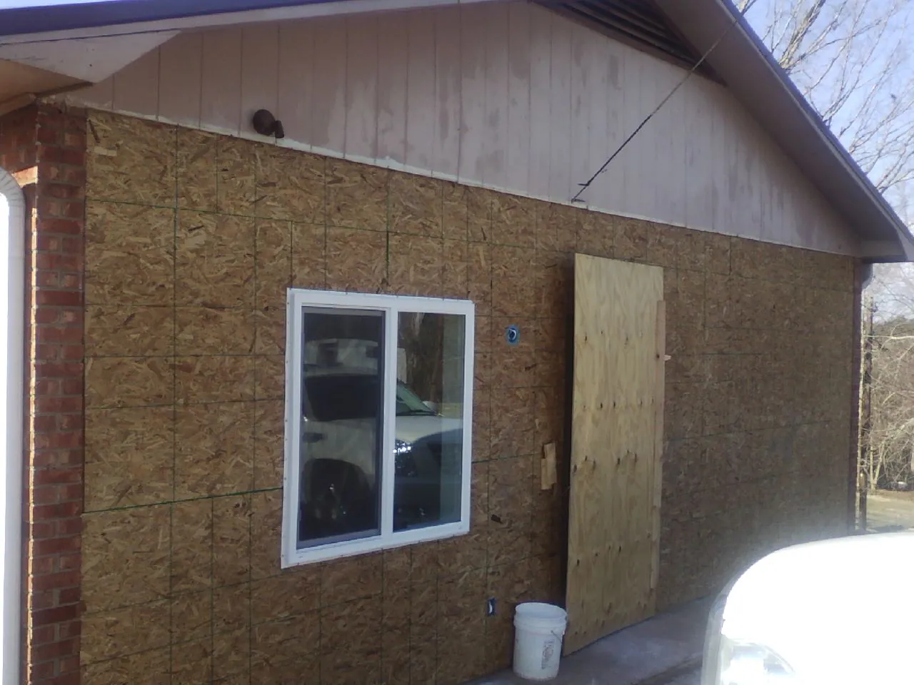 OSB sheathing on a garage addition wall before siding in Big Rock